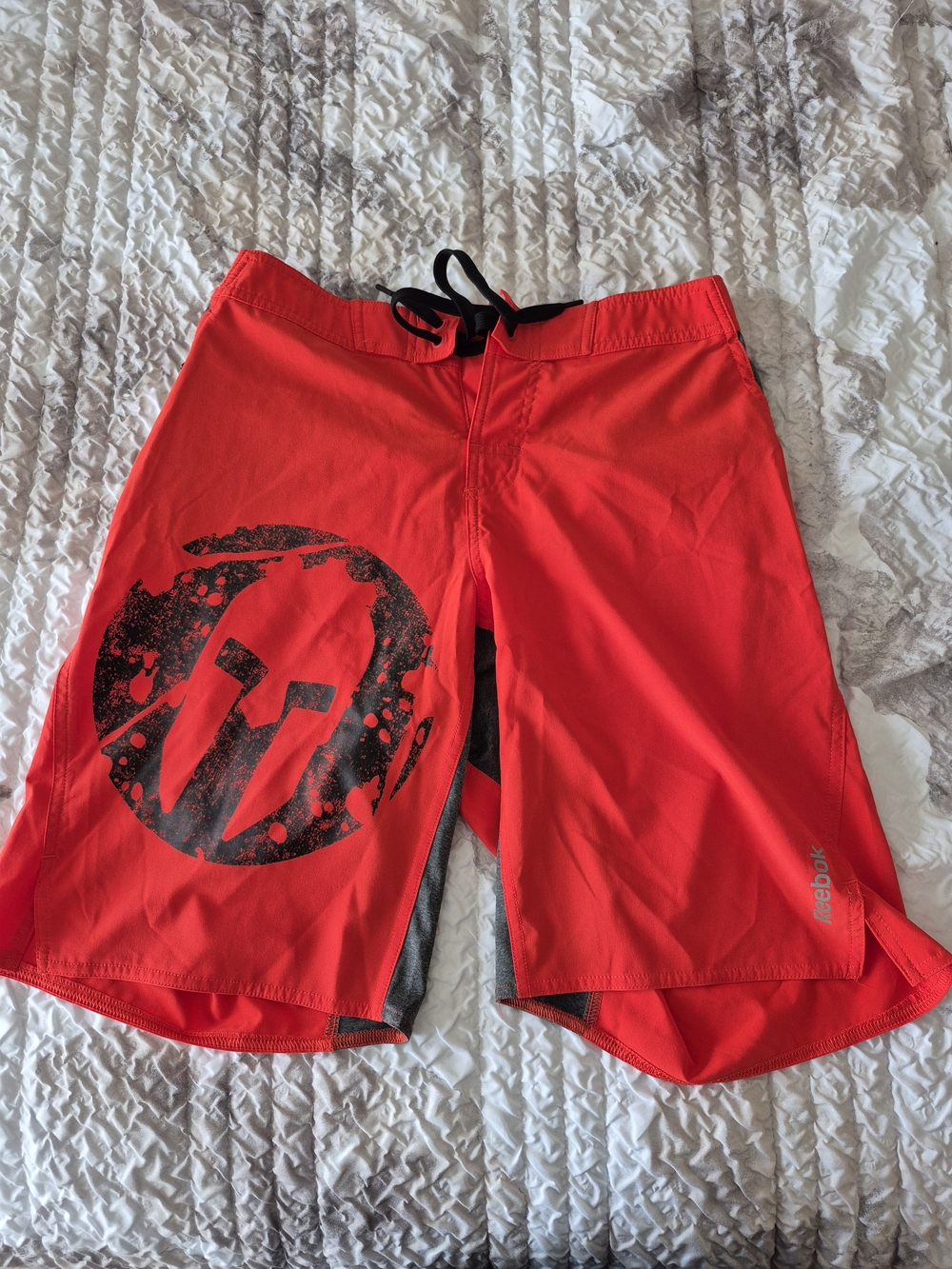 Reebok Red Men’s Swim Board Shorts with Black Spartan Graphic